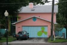 Pink house with colored garage door